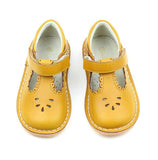 Angie is a vintage inspired shoe in the loveliest golden hue. The scalloped detail just sweetens up every outfit.  For those of you whose little one is outgrowing the Dottie,  fret not because Angie is an extension of the darling style!   This mustard leather offers a unique patina and a sturdiness that can withstand the greatest adventures.  Note: for an added touch, pair with our socks.